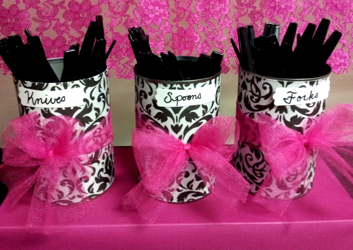 Simple cans covered in paper with a tulle bow,